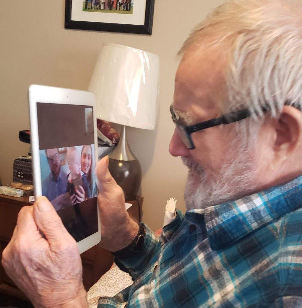 A resident at Sienna Senior Living’s residence in St. Catherine’s, Ont. speaks with his family using Skype.