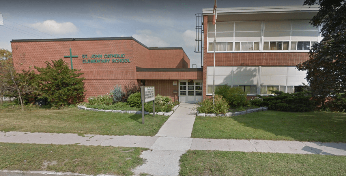 Peterborough police are investigating after they say derogatory slurs were found spray-painted on property at St. John Catholic Elementary School.