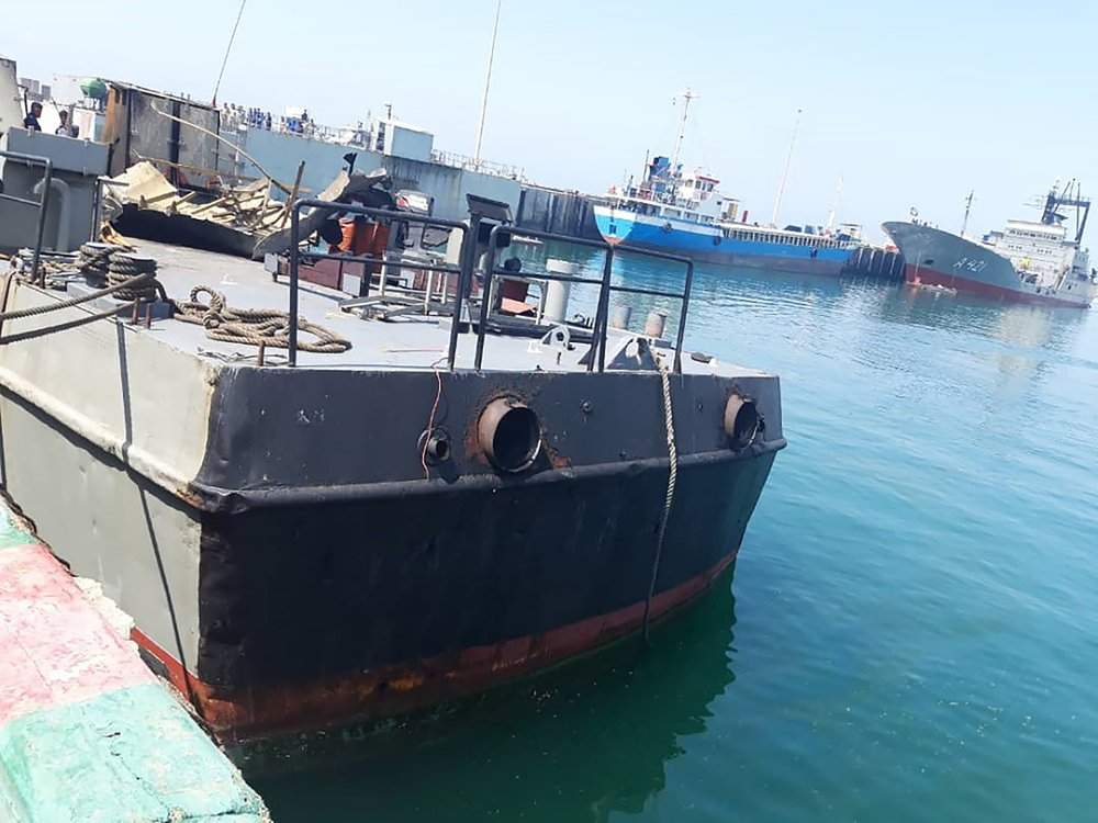 In this photo provided Monday, May 11, 2020, by the Iranian Army, the Konarak support vessel which was struck during a training exercise in the Gulf of Oman, is docked in an unidentified naval base in Iran. An Iranian missile fired during a training exercise in the Gulf of Oman struck a support vessel near its target, killing 19 sailors and wounding 15, Iran's state media reported on Monday, amid heightened tensions between Tehran and the U.S. 