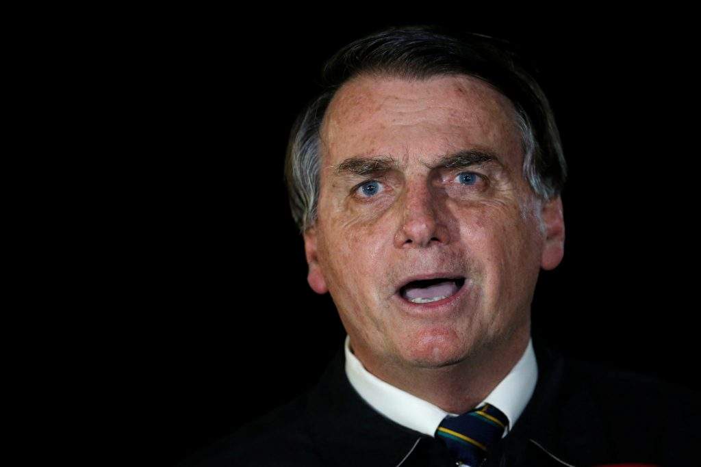 Brazil's President Jair Bolsonaro speaks with journalists as he arrives at Alvorada Palace, amid the coronavirus disease (COVID-19) outbreak, in Brasilia, Brazil, May 22, 2020. 