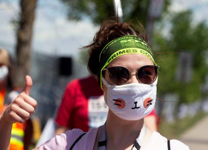 A woman wearing a face mask gives a thumbs-up as healthcare workers, professionals and unions demanding safer working conditions and time off amid the coronavirus disease (COVID-19) outbreak protest in front of Santa Cabrini Hospital in Montreal, Quebec, Canada May 29, 2020. 