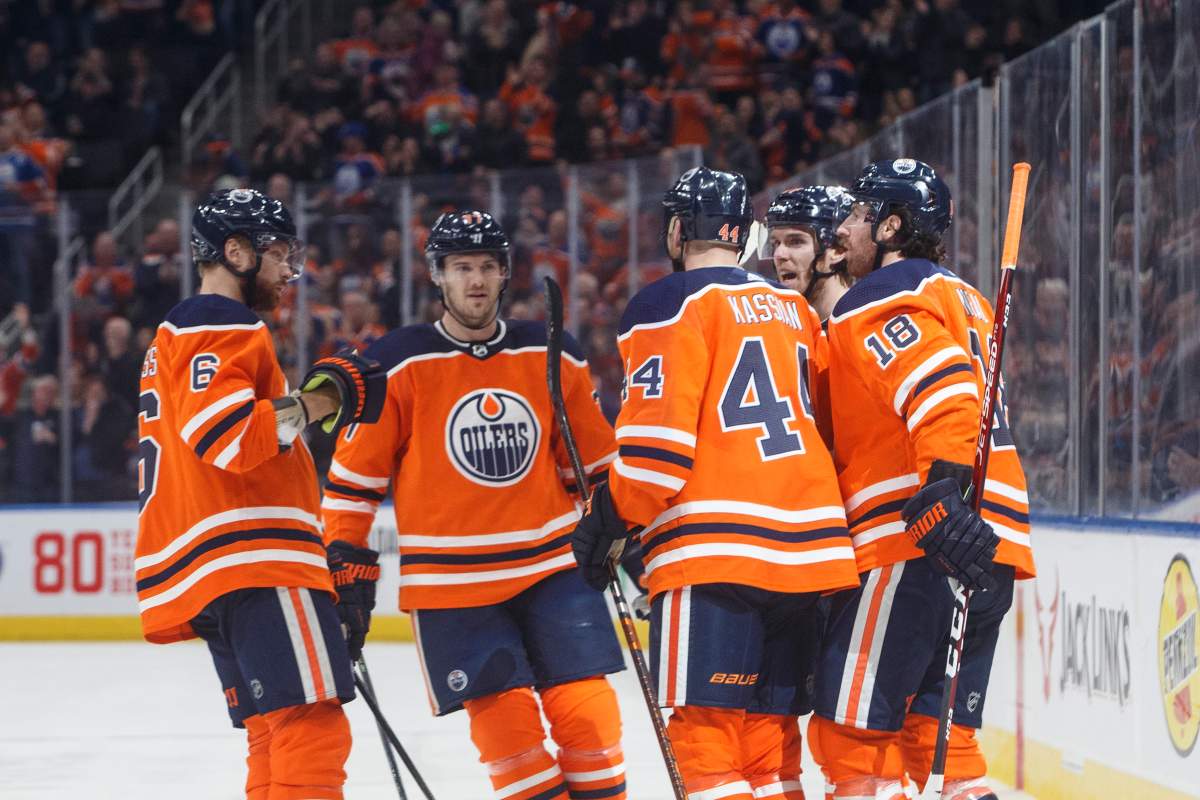 Edmonton Oilers celebrate a goal against the Winnipeg Jets during second period NHL action in Edmonton, Alta., on Wednesday March 11, 2020. THE CANADIAN PRESS/Jason Franson.