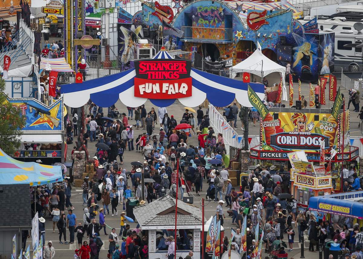 Crowds flock to the midway at the Calgary Stampede on Sunday, July 7, 2019. The Calgary Stampede’s board of directors has cancelled the world-famous exhibition and rodeo this year because of COVID-19.