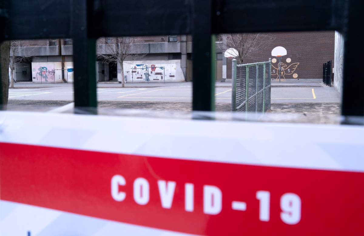 A closed schoolyard is seen through its fence in Montreal, Monday, April 27, 2020. 