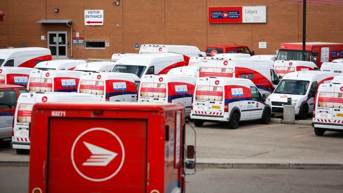 Delivery vehicles are seen at Canada Post’s main plant in Calgary, Alta., Saturday, May 9, 2020, amid the COVID-19 pandemic.