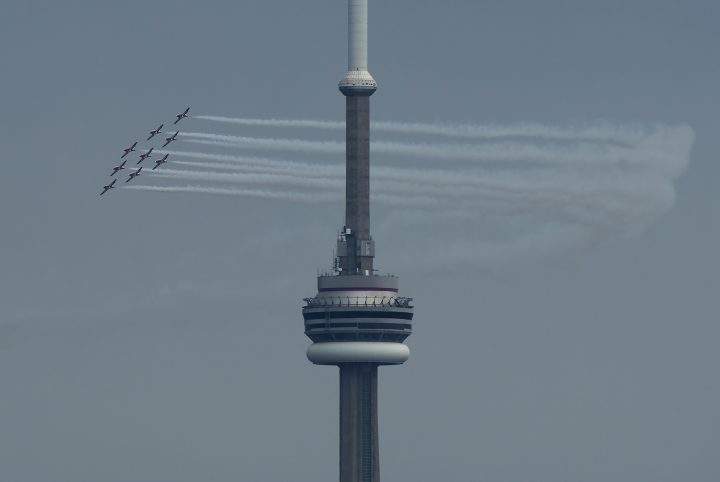 The Canadian Snowbirds circle the CN Tower as part of Operation Inspiration during the COVID-19 pandemic in Toronto on Sunday, May 10, 2020.