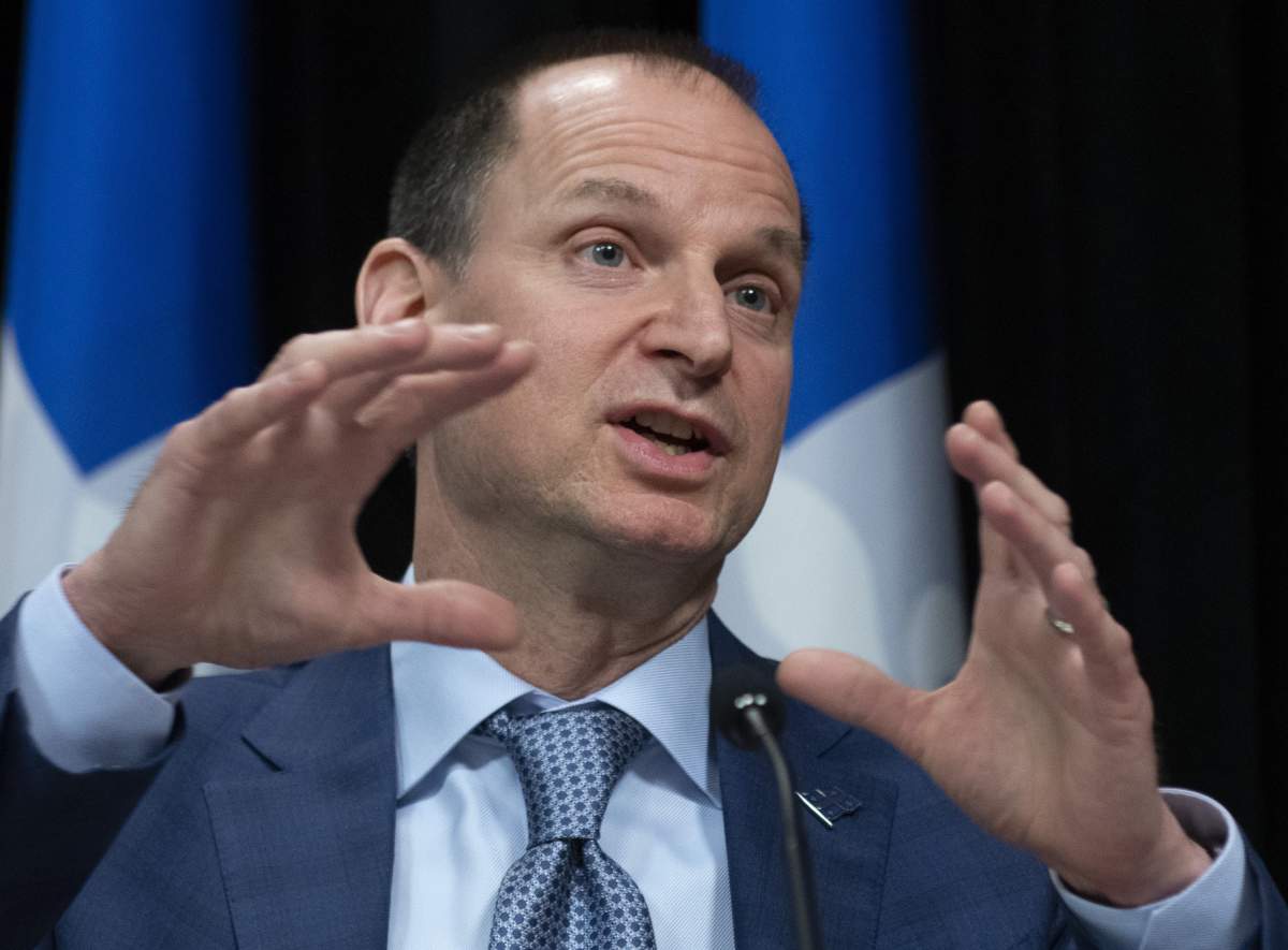 Quebec Finance Minister Eric Girard responds to reporters at a news conference on the COVID-19 pandemic, Friday, April 3, 2020 at the legislature in Quebec City. 