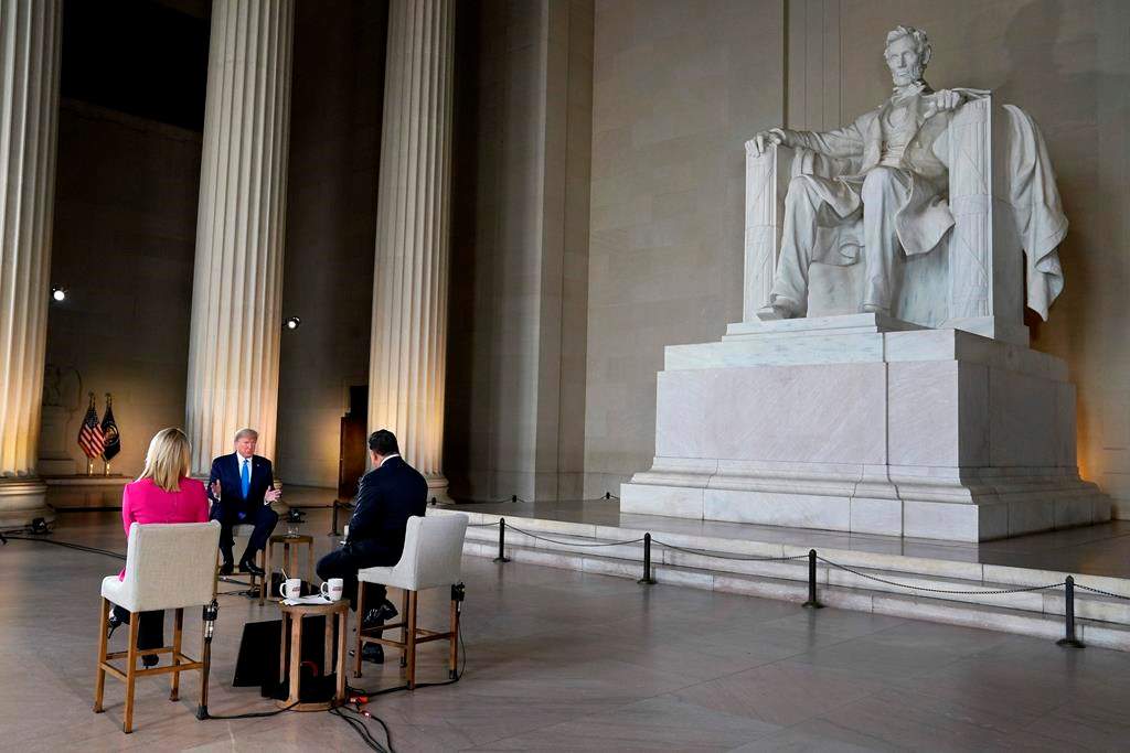 President Donald Trump speaks during a Fox News virtual town hall from the Lincoln Memorial, Sunday, May 3, 2020, in Washington, co-moderated by FOX News anchors Bret Baier and Martha MacCallum. (AP Photo/Evan Vucci)