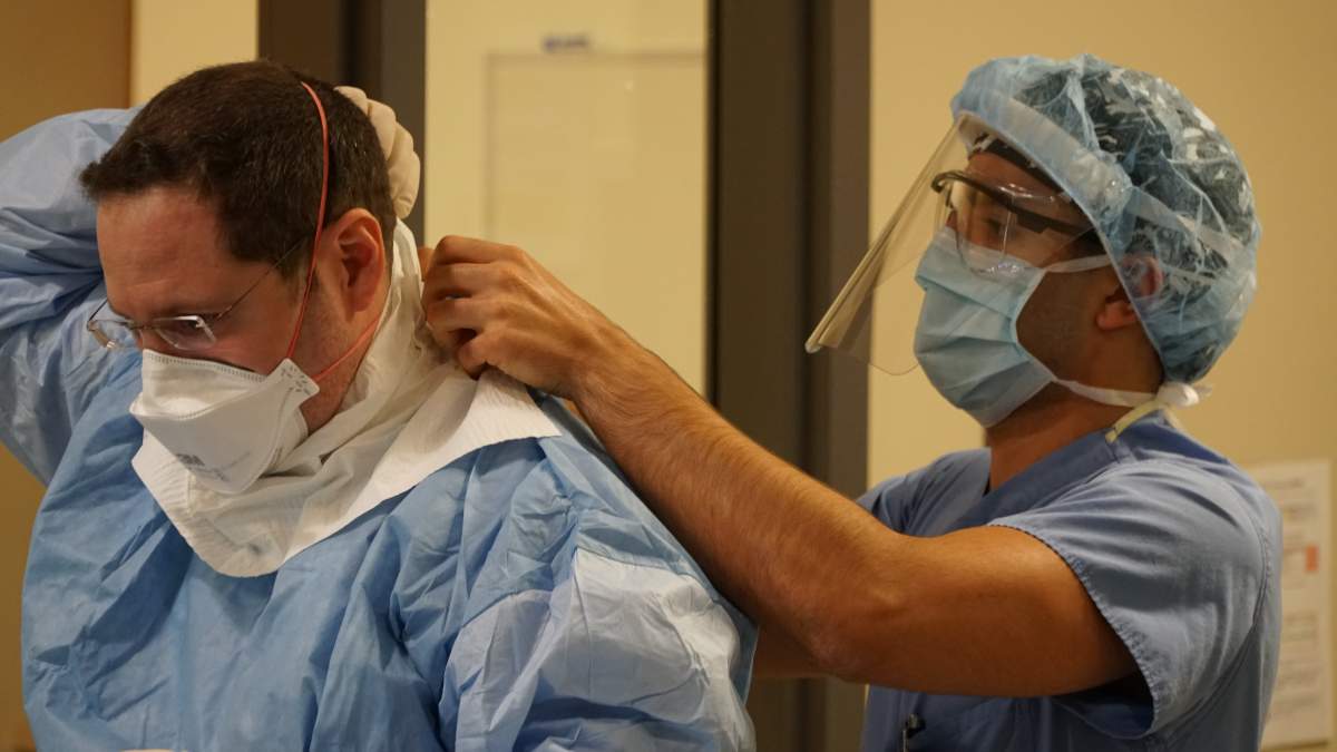 Dr. Jamie Spiegelman says it takes twice as long to prepare for an intubation procedure due to the extra layers of personal protective equipment.