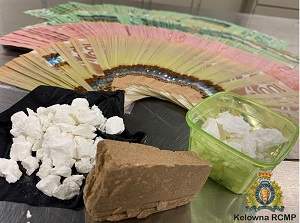 Police said they seized cash and illicit drugs when they searched a Kelowna home on Wednesday. 