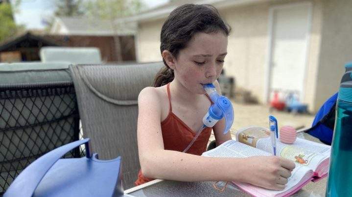 Ella McDougall,10, who lives with cystic fibrosis, undergoes three breathing treatments a day.