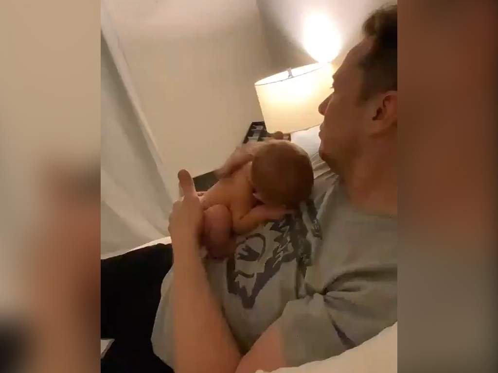 Elon Musk cuddling his newborn son X Æ A-12 on May 11, 2020.