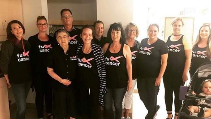 Amanda Niebergall, centre, surrounded by family on her last day of radiation treatment in 2018.