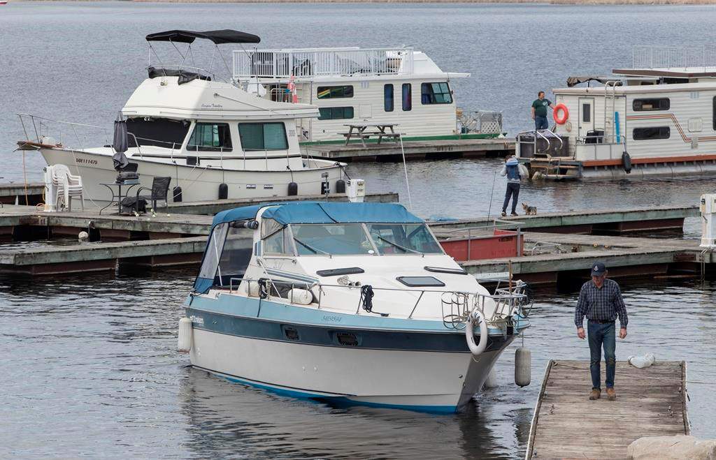 Boats get launched at Kawartha Lakes Marina in Bobcaygeon, Ont., on Saturday, May 16, 2020.