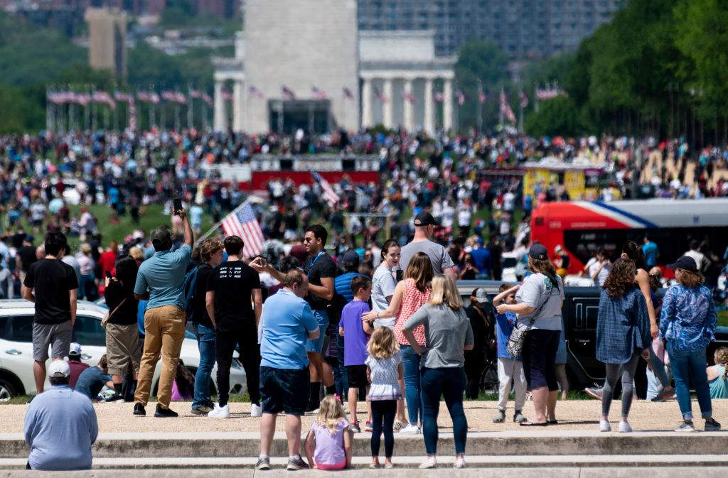 A large crowd gathers on the National Mall to watch the navy’s Blue Angels and the air force’s Thunderbirds conduct a flyover of Washington, D.C., to honour essential workers and health-care providers who are confronting the COVID-19 pandemic on Saturday, May 2, 2020.