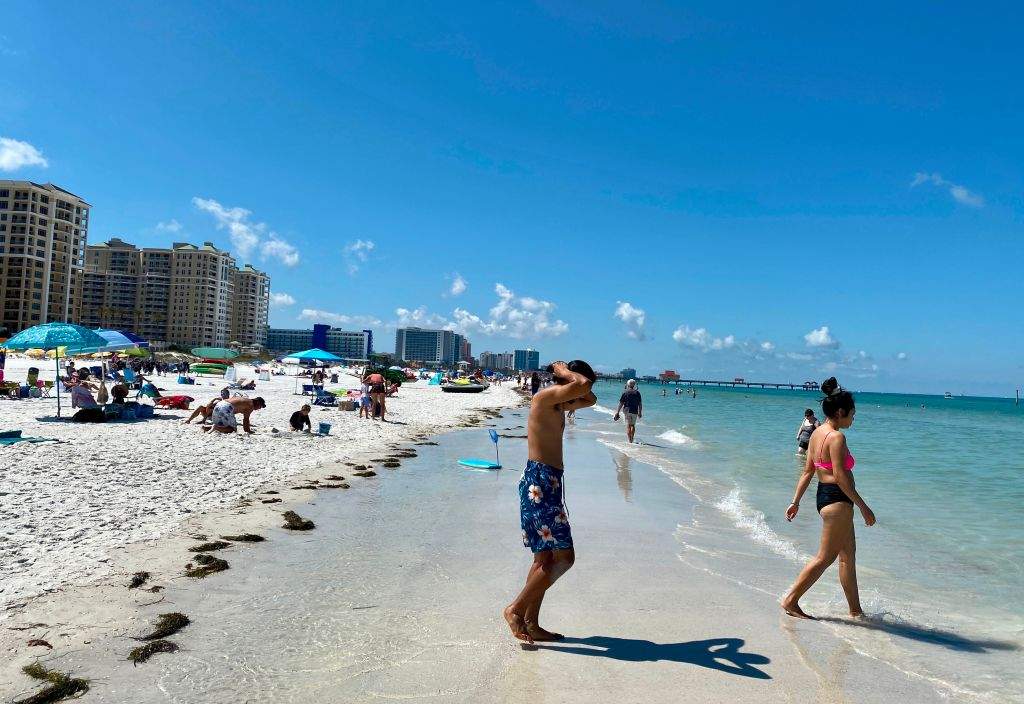 People gather at Clearwater Beach in the Tampa Bay, Florida area as the beach was officially open to the public on May 4, 2020.