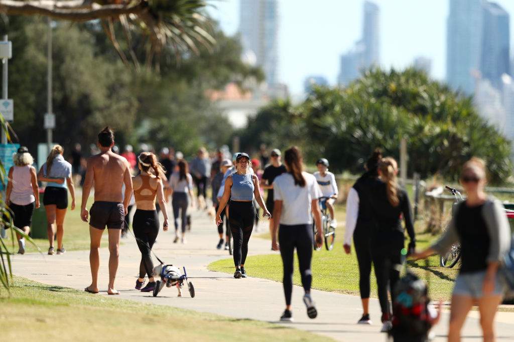People walk along Miami foreshore on May 2, 2020 in Gold Coast, Australia. The Queensland government has eased COVID-19 lockdown measures in response to a decline in coronavirus cases across the state.