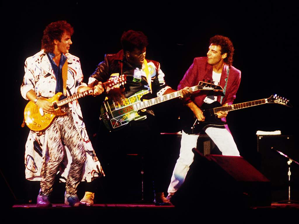 (L-R) Jonathan Cain, Randy Jackson and Neal Schon performing with Journey at the Calaveras County Fairgounds in Jackson, Calif. on Aug. 23, 1986.