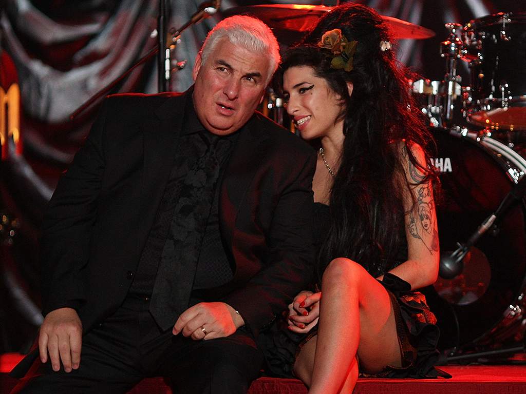 Amy Winehouse sits with her father Mitch as they await news of her Grammy Award at The Riverside Studios for the 50th Grammy Awards ceremony on Feb. 10, 2008, in London, England.