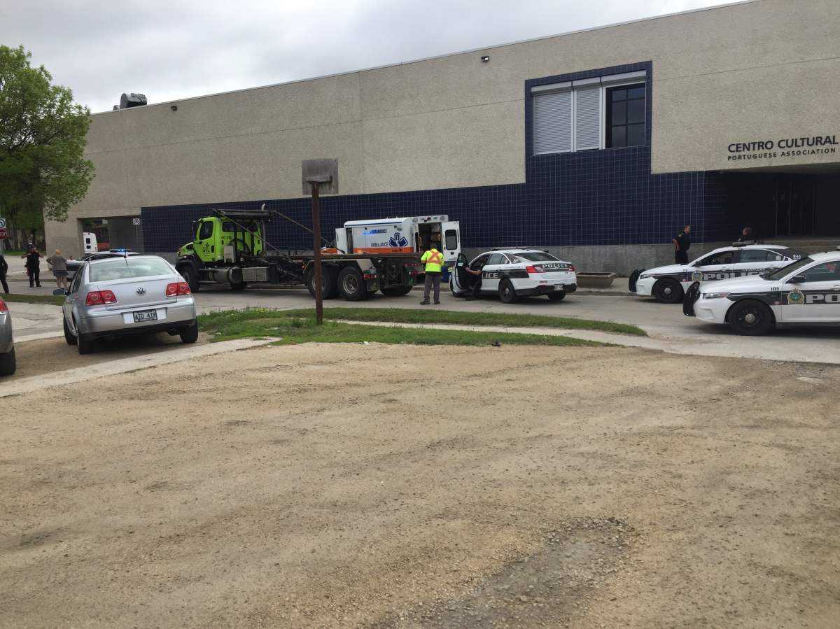 Police and a tow truck on scene Friday at the Portuguese Cultural Centre.