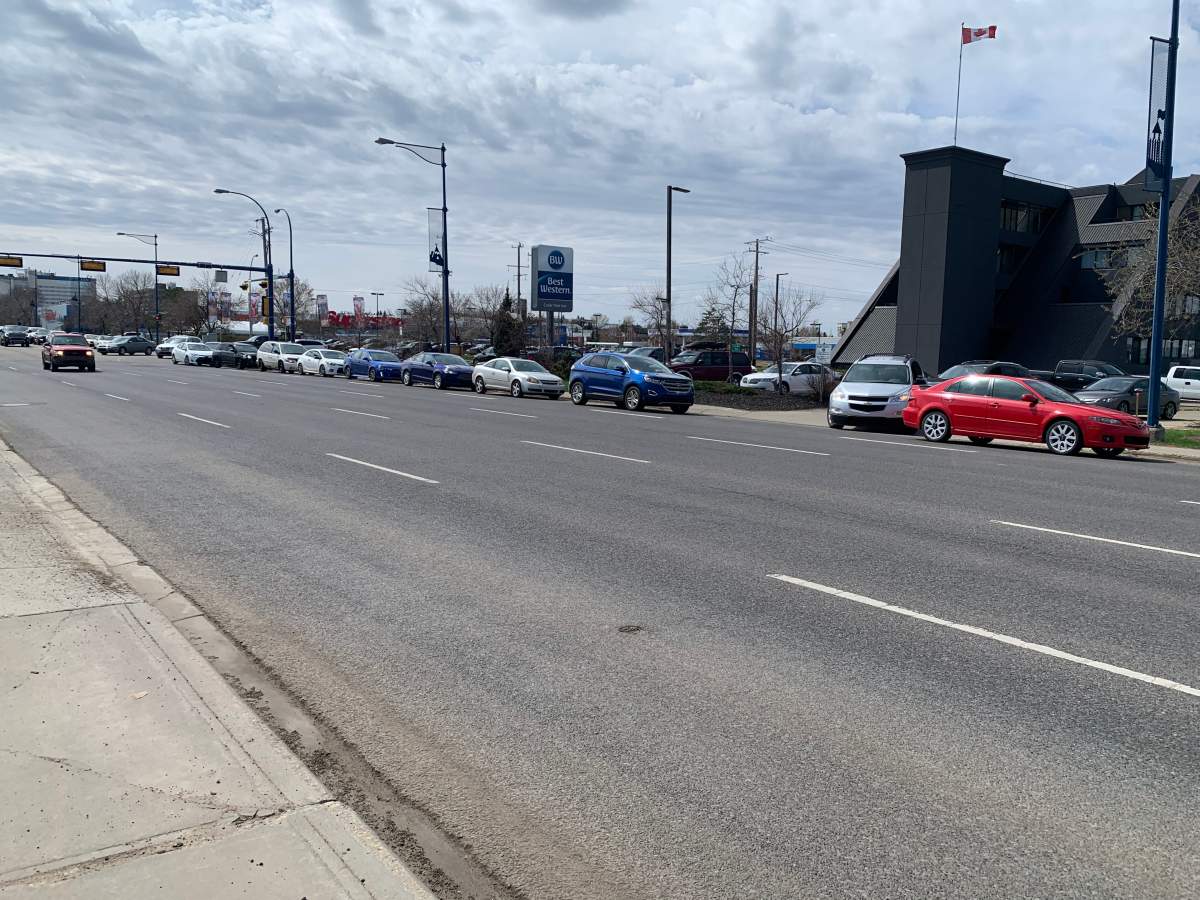 The lineup for Peters’ Drive-In in south Edmonton stretches south on Gateway Boulevard on May 5, 2020