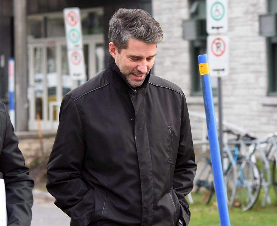 Former PQ chief, Andre Boisclair, exits a police station in Quebec City, on November 9, 2017.