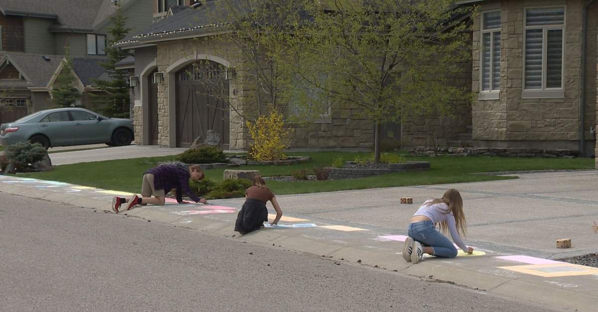 Calgary children busted out the chalk to create a life-sized version of Monopoly.