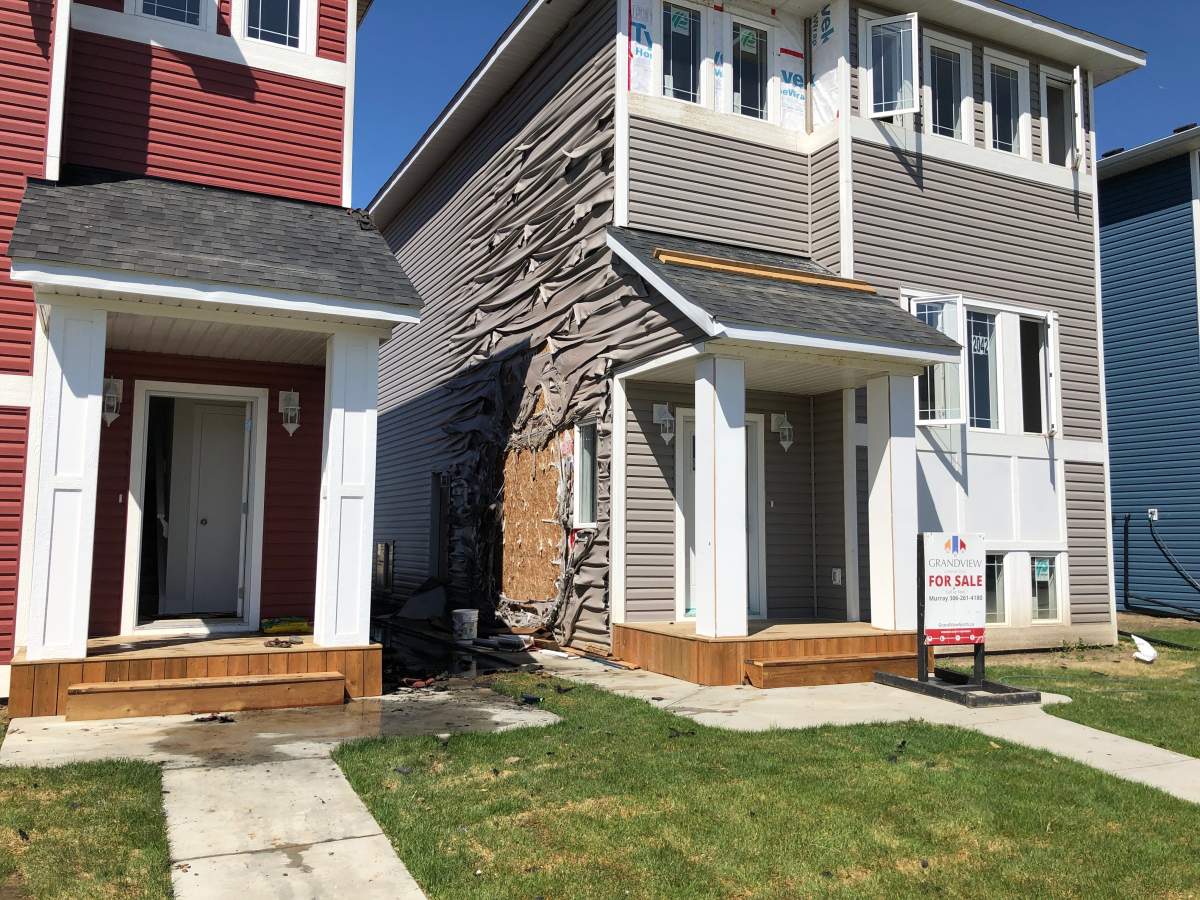 Three Saskatoon residents extinguished a fire with garden hoses on Sunday afternoon.