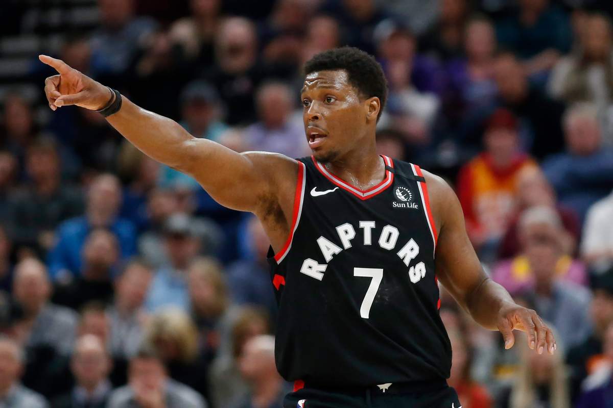 Toronto Raptors guard Kyle Lowry (7) directs his team in the first half during an NBA basketball game against the Utah Jazz, Monday, March 9, 2020, in Salt Lake City.