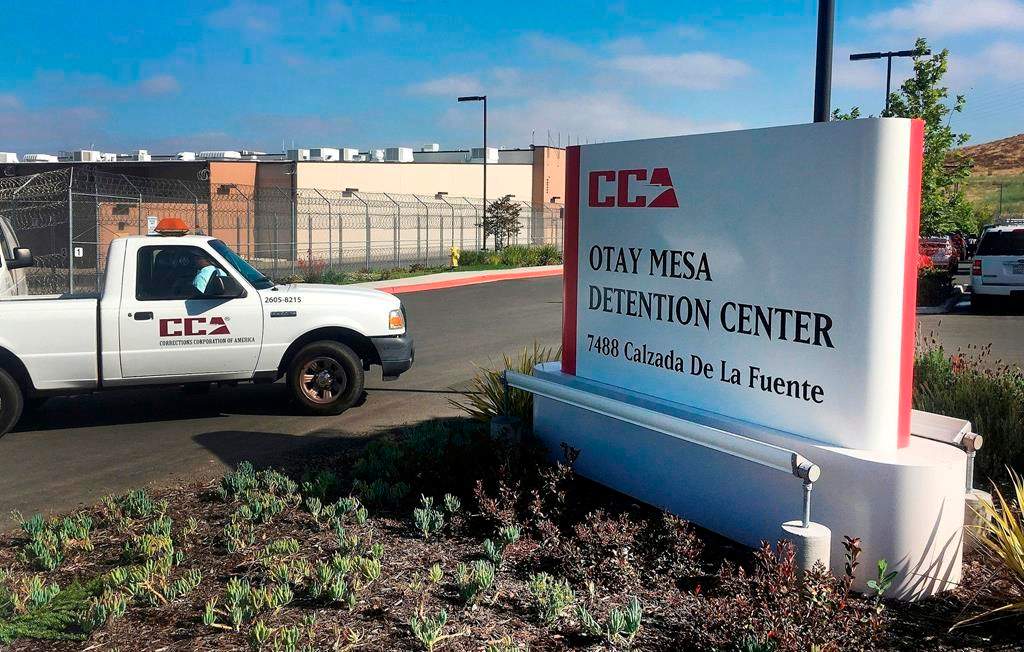 FILE - In this June 9, 2017, file photo, a vehicle drives into the Otay Mesa Detention Center in San Diego. Authorities say a 57-year-old person in immigration custody has died from complications related to the coronavirus, marking the first reported death from the virus among about 30,000 people in U.S. immigration custody.