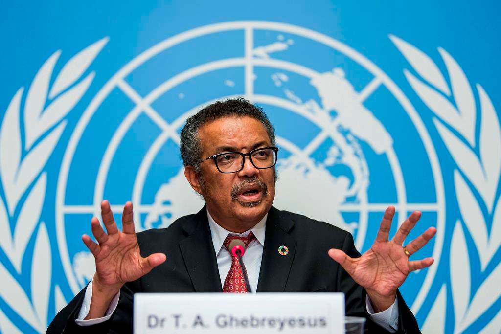 FILE-Int this Feb. 7, 2018 file photo Tedros Adhanom Ghebreyesus, director general of the World Health Organization (WHO), answers questions of the journalists about his first seven months in office and outlines the organization's priorities for the next five years, at the European headquarters of the United Nations in Geneva, Switzerland. The World Health Organization‚Äôs director-general has faced many challenges during the coronavirus pandemic: racial slurs, death threats, social media caricatures ‚Äî he was once depicted as a ventriloquist‚Äôs dummy in the hands of Chinese President Xi Jinping ‚Äî and U.S. funding cuts. (Martial Trezzini/Keystone via AP).