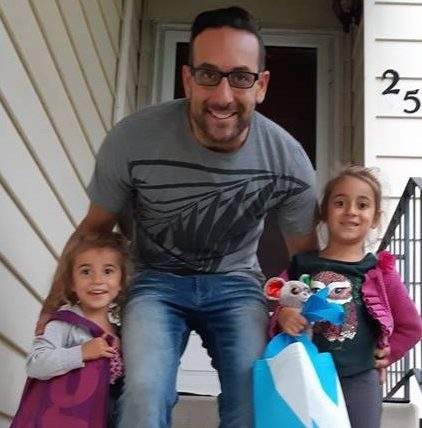 Lily and Bella Rose Desrosiers, with their late father Ben, outside their house in the southeast Edmonton, Alta.