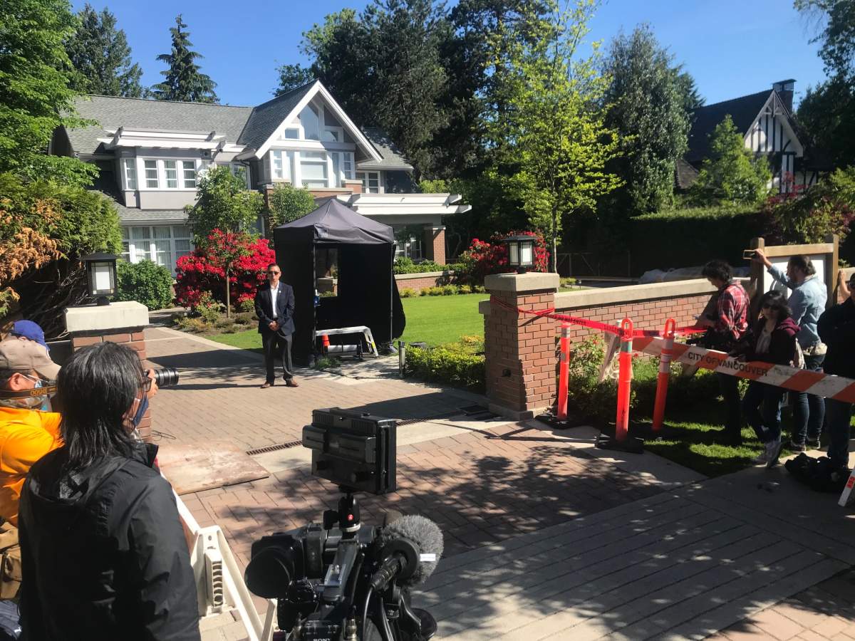 Media and security outside Meng Wanzhou’s house Wednesday, May 27, 2020.