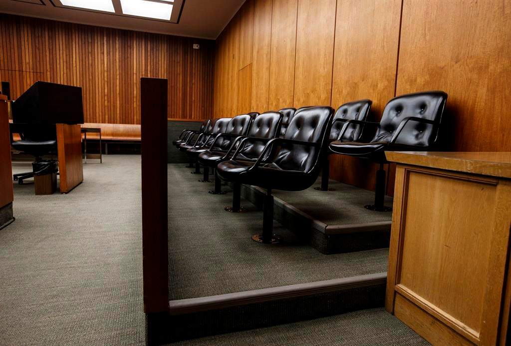 A jury box is shown in a courtroom at the Edmonton Law Courts building in Edmonton on Friday, June 28, 2019. An Edmonton criminal law firm says COVID-19 restrictions in Alberta's courthouses have led to an untenable situation. THE CANADIAN PRESS/Jason Franson.