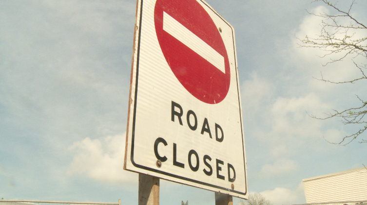 Road closed sign.