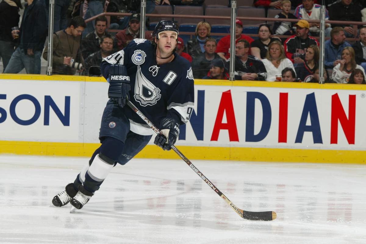 Ryan Smyth looks for a pass in the Oilers third jersey designed by Todd McFarlane.