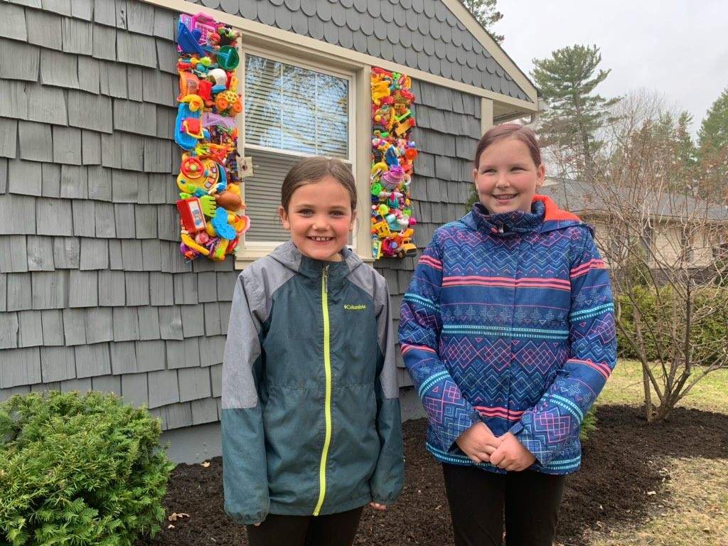 Taya Nash & Peyton Kehoe stopped for a photo with the toy shutters