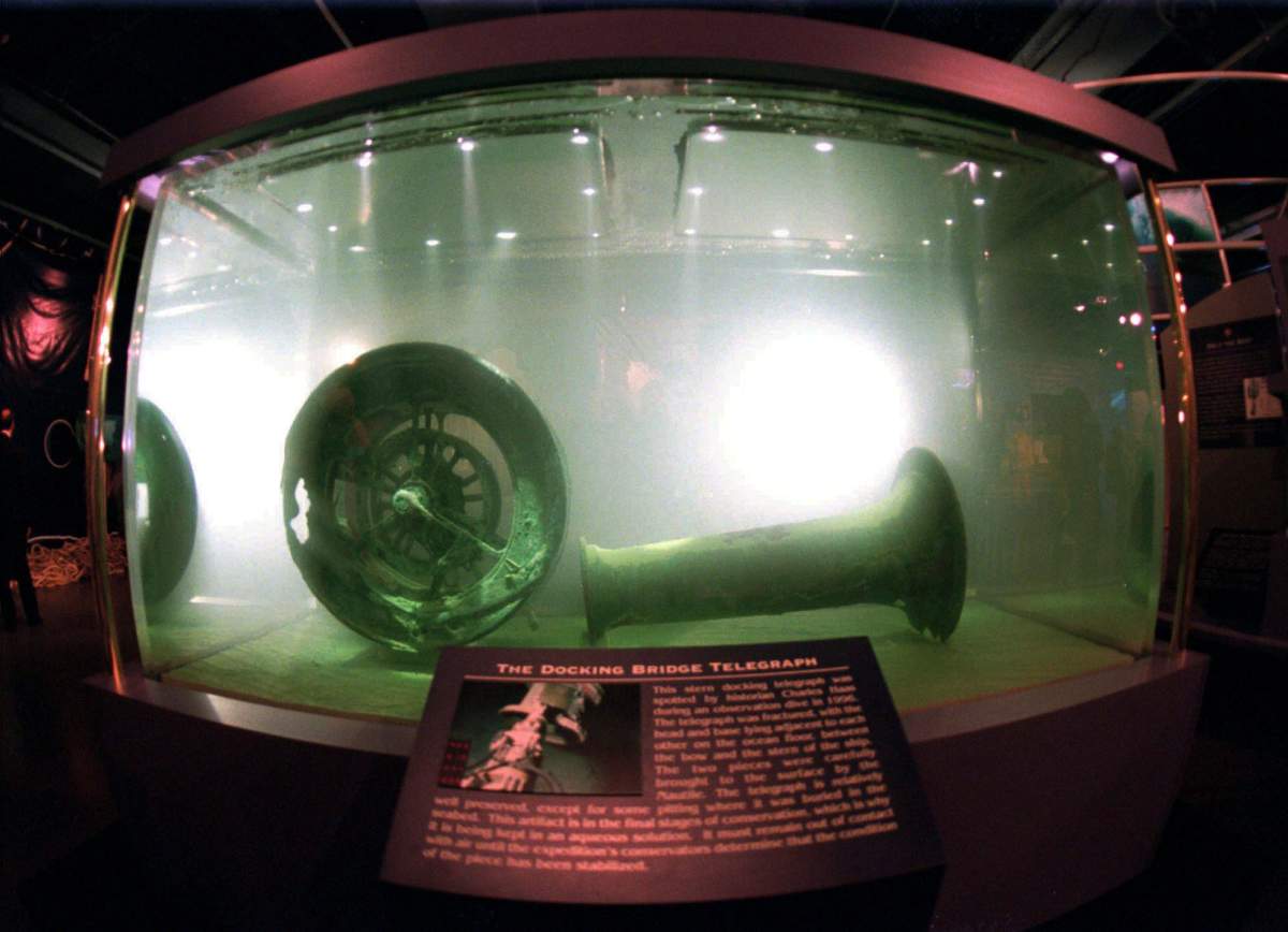 In this Nov. 26, 1996 file photo, the docking bridge telegraph recovered from the wreckage of the Titanic is displayed in a large seawater-filled tank at the Nauticus National Maritime Center in Norfolk, Va.