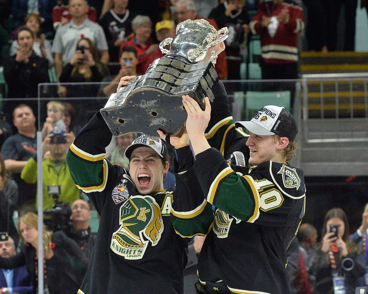 Co Captains Mitch Marner and Christian Dvorak of the London Knights hoist the Memorial Cup at the 2016 MasterCard Memorial Cup in Red Deer, Alberta on Sunday May 29, 2016. Photo by Terry Wilson / CHL Images.