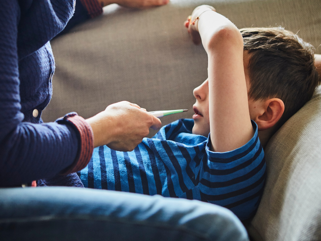 Symptoms of measles include a fever of 38.3° C or higher, a cough, runny nose and a rash that usually starts behind the ears or on the face and spreads down the body.