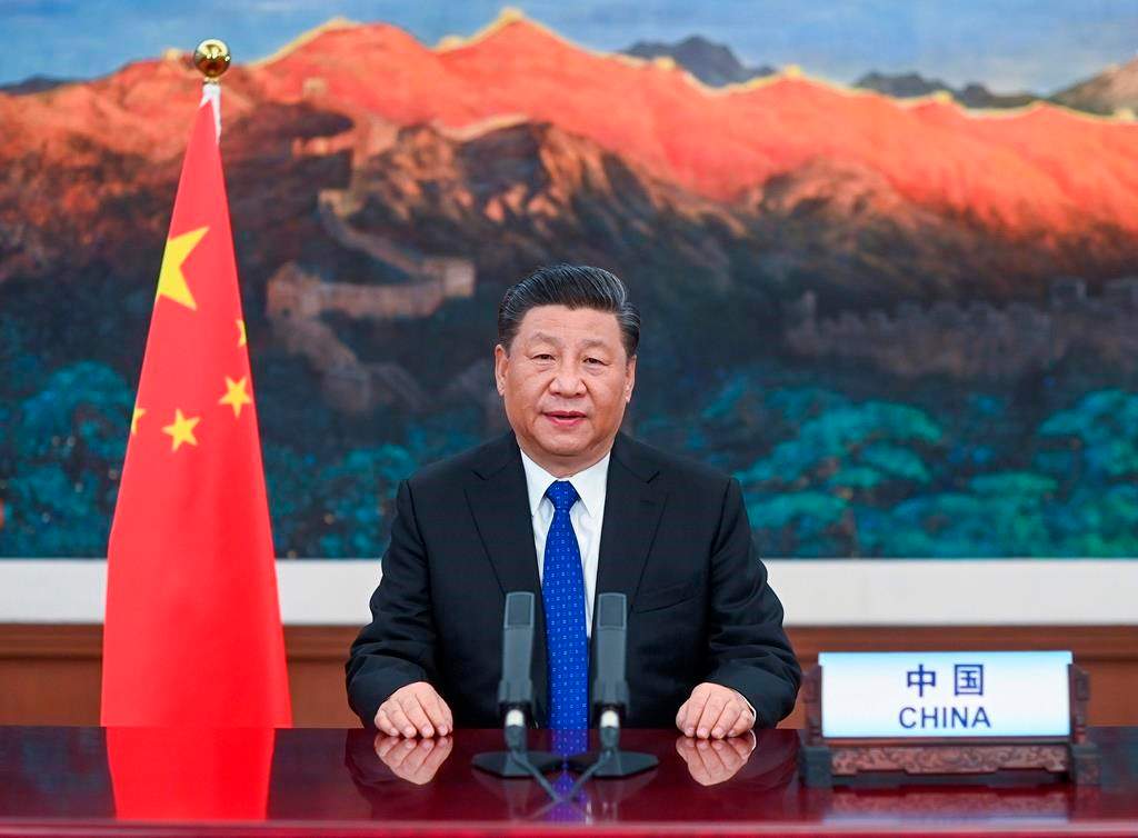 In this photo released by Xinhua News Agency, Chinese President Xi Jinping delivers a speech at the opening of the 73rd World Health Assembly via video link in Beijing, Monday, May 18, 2020. China on Monday announced it will give $2 billion to the fight against the coronavirus. As nations carved out a new normal amid the pandemic, Chinese President Xi Jinping told the World Health Organization's annual meeting Monday that the funds would be paid out over two years to help respond to COVID-19, which has already killed hundreds of thousands and devastated national economies. (Li Xueren/Xinhua via AP).
