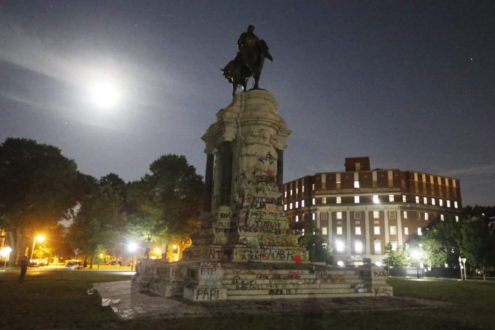 The moon illuminates the statue of Confederate General Robert E. Lee on Monument Avenue Friday, June 5, 2020, in Richmond, Va. Virginia Gov. Ralph Northam has ordered the removal of the statue.
