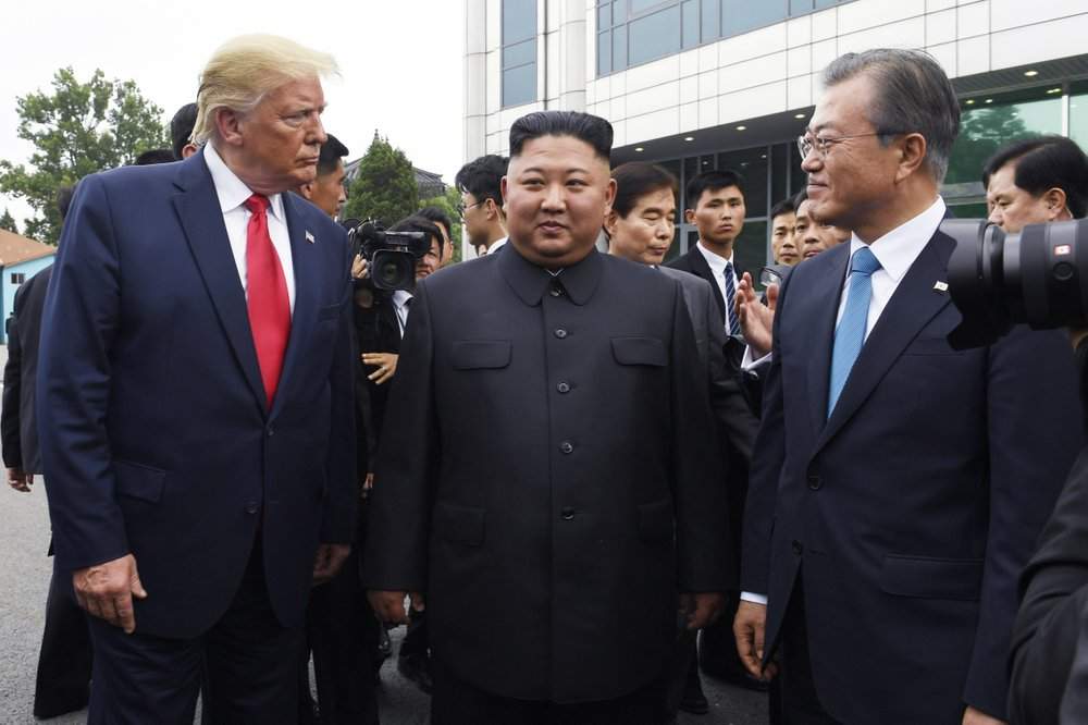 FILE - In this June 30, 2019, file photo, President Donald Trump, left, meets with North Korean leader Kim Jong Un and South Korean President Moon Jae-in, right, at the border village of Panmunjom in the Demilitarized Zone, South Korea. North Korea on Saturday, June 13, 2020 again bashed South Korea, telling its rival to stop “nonsensical” talk about its denuclearization and vowing to expand its military capabilities. 