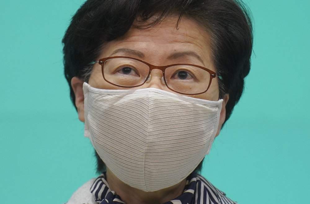 Hong Kong Chief Executive Carrie Lam listens to reporters' questions during a press conference in Hong Kong, Tuesday, June 16, 2020. Lam said she hoped that the opposition would not “demonize and stigmatize” the national security law as doing do would mean pitting themselves against the people of Hong Kong.