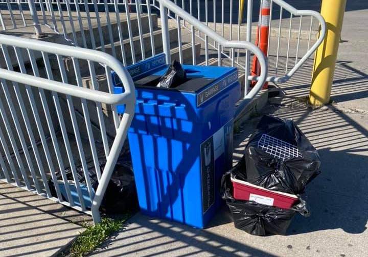 Abby Lorenzen reportedly saw puppy paws sticking out from the garbage as she was leaving.