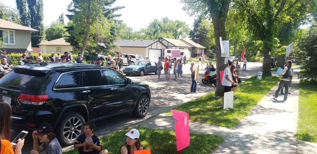Around 100 people gathered Saturday in Edmonton to protest the release of a man charged with sexual assault.