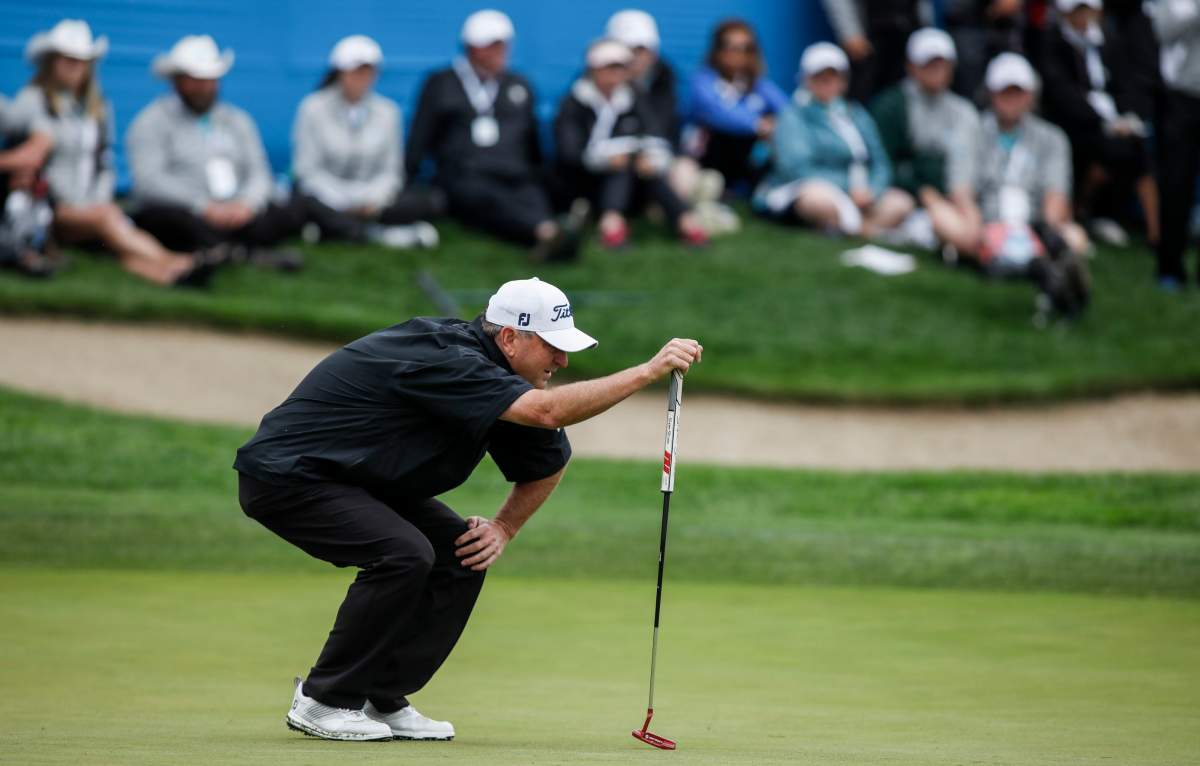 Wes Short Jr., of Austin, TX, lines up his putt on the 18th green during the PGA Tour Champion's Shaw Charity Classic golf event in Calgary, Sunday, Sept. 1, 2019. 