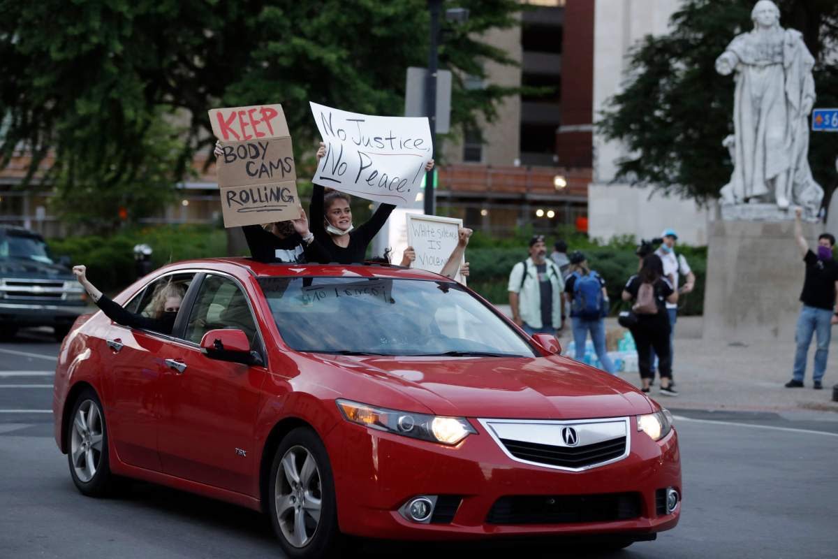 Demonstrators protest over the deaths of George Floyd and Breonna Taylor, Monday, June 1, 2020, in Louisville, Ky. Breonna Taylor, a black woman, was fatally shot by police in her home in March. (AP Photo/Darron Cummings).