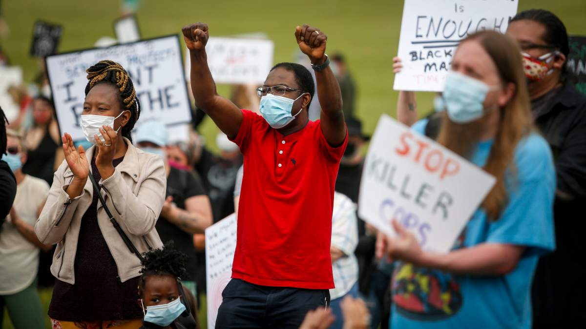 Black Lives Matter protesters gather in Innisfail, Alta., Saturday, June 13, 2020, amid the COVID-19 pandemic.