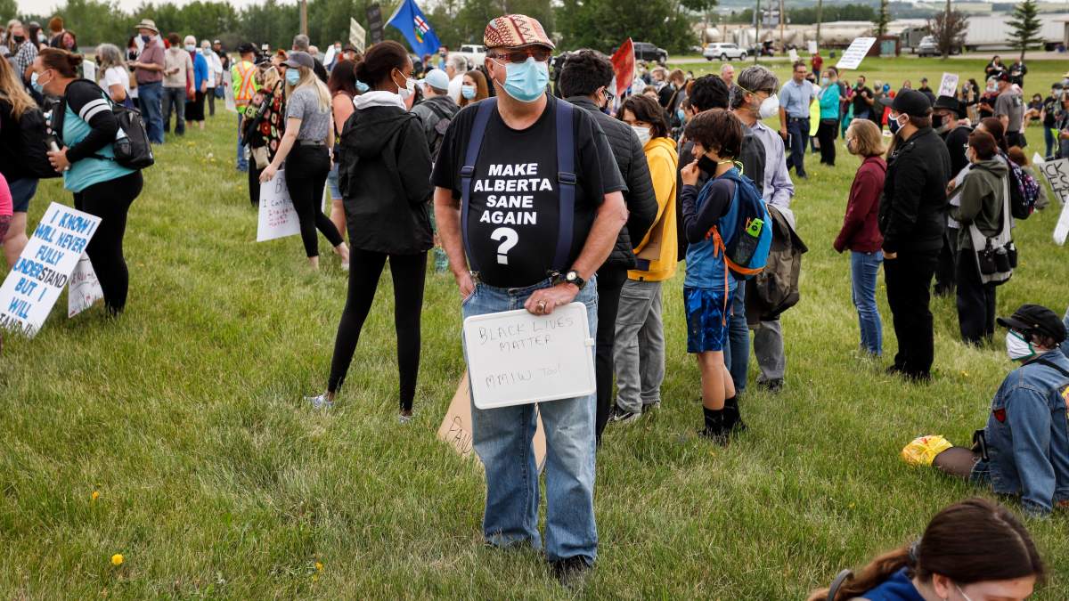 Black Lives Matter protesters gather in Innisfail, Alta., Saturday, June 13, 2020, amid the COVID-19 pandemic.